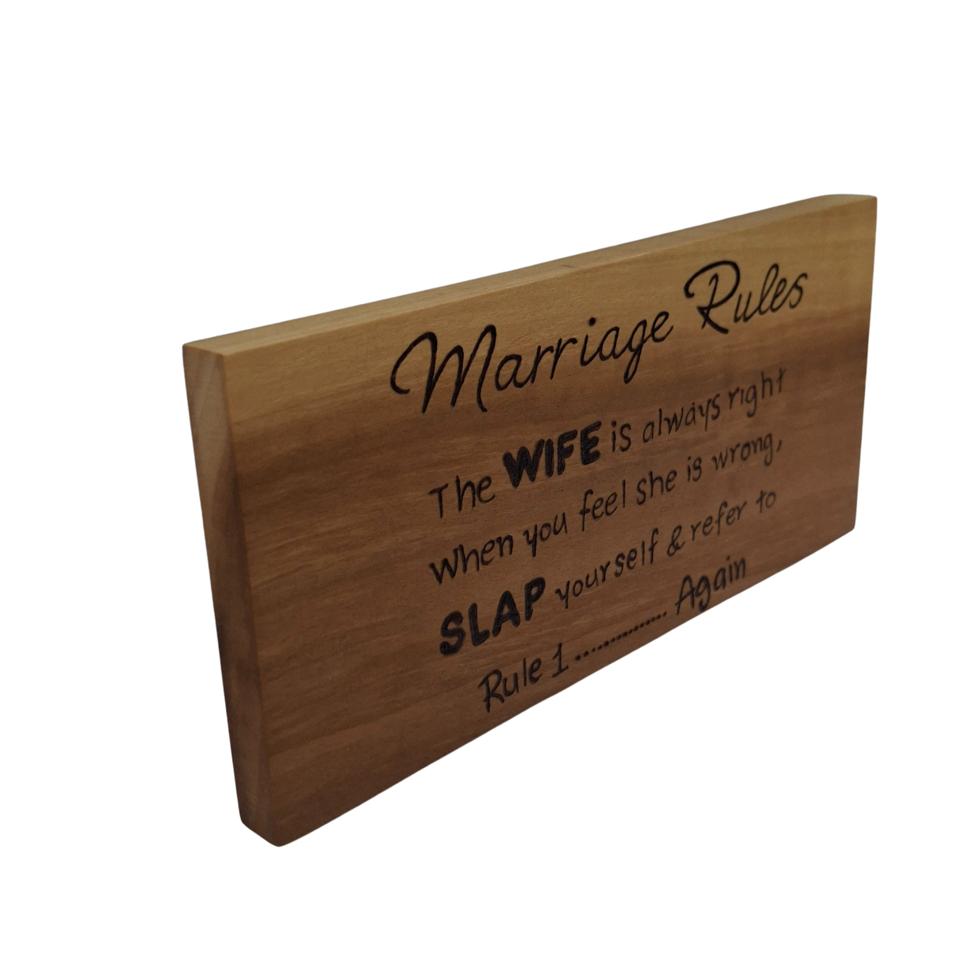 Wooden sign with humorous text about marriage rules on a white background