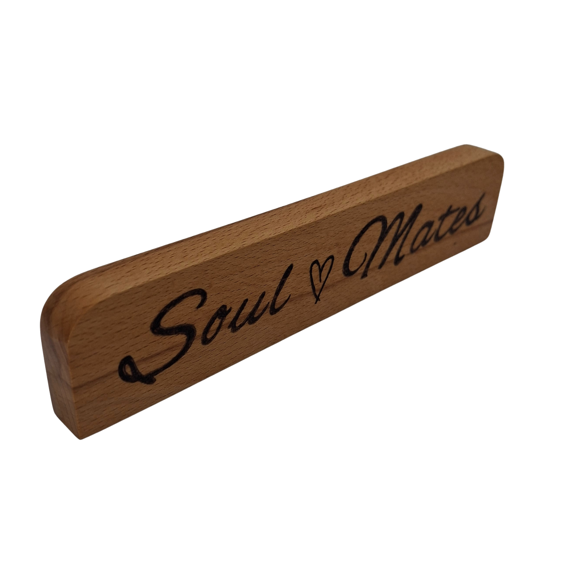 Wooden sign with 'Soul Mates' hand burnt on a white background
