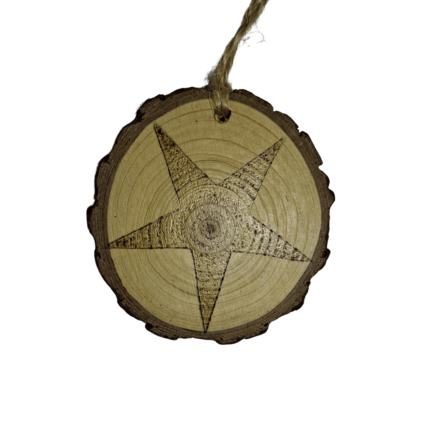 
A close-up of a Christmas ornament on a black background. The ornament is a round wooden log slice with a jute rope for hanging. The front of the log slice is decorated with a pyrography design of a five-pointed star.