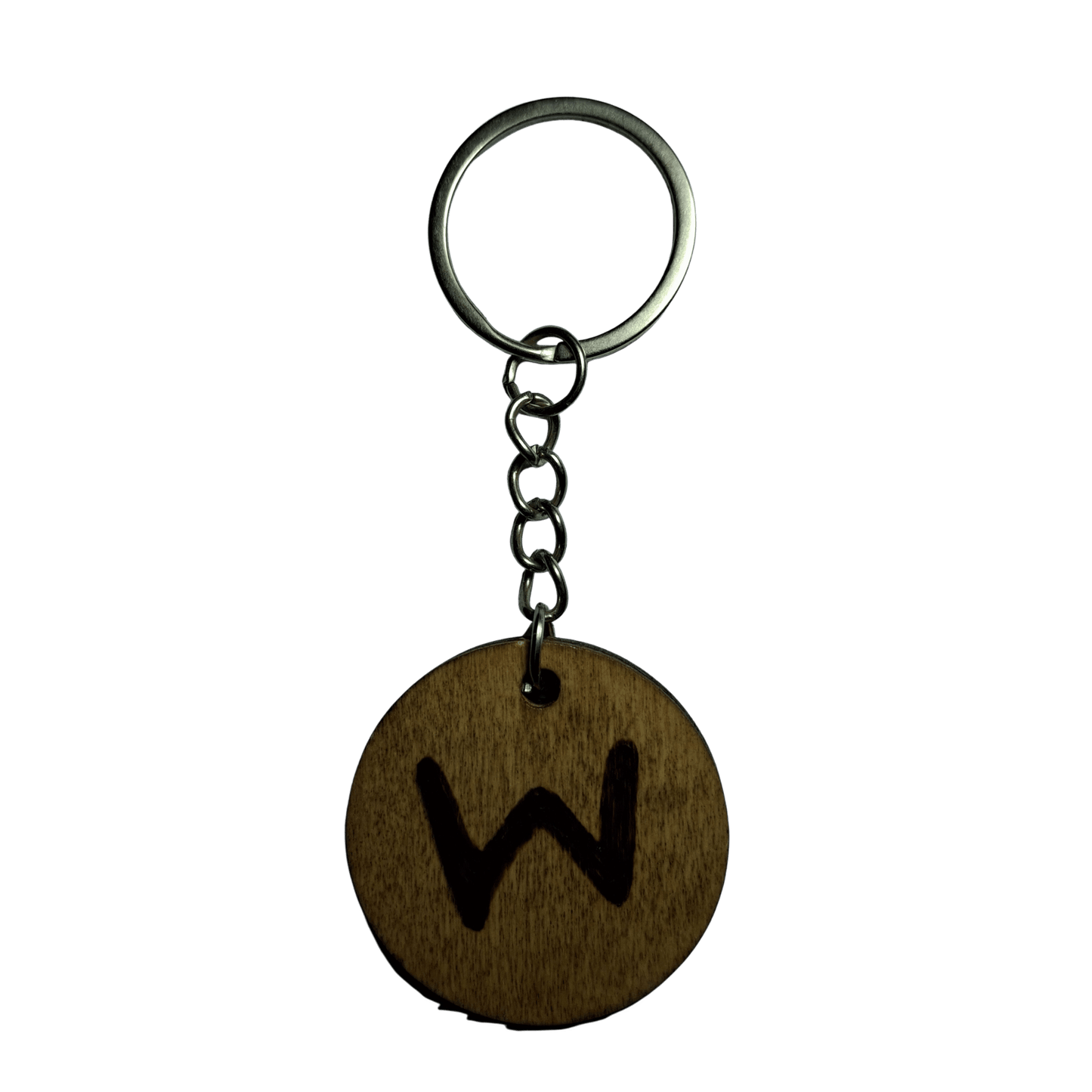 Round keyring made from veneered plywood. The letter W is hand-burnt using pyrography, finished with a hardwax oil, and attached to a silver keychain.