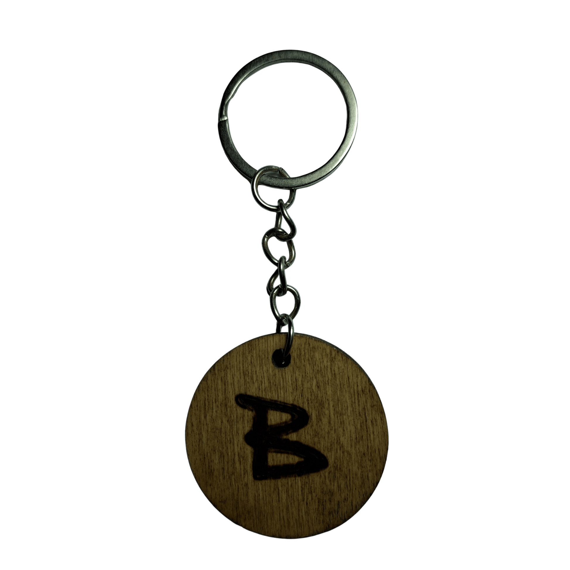 Round keyring made from veneered plywood. The letter B is hand-burnt using pyrography, finished with a hardwax oil, and attached to a silver keychain.