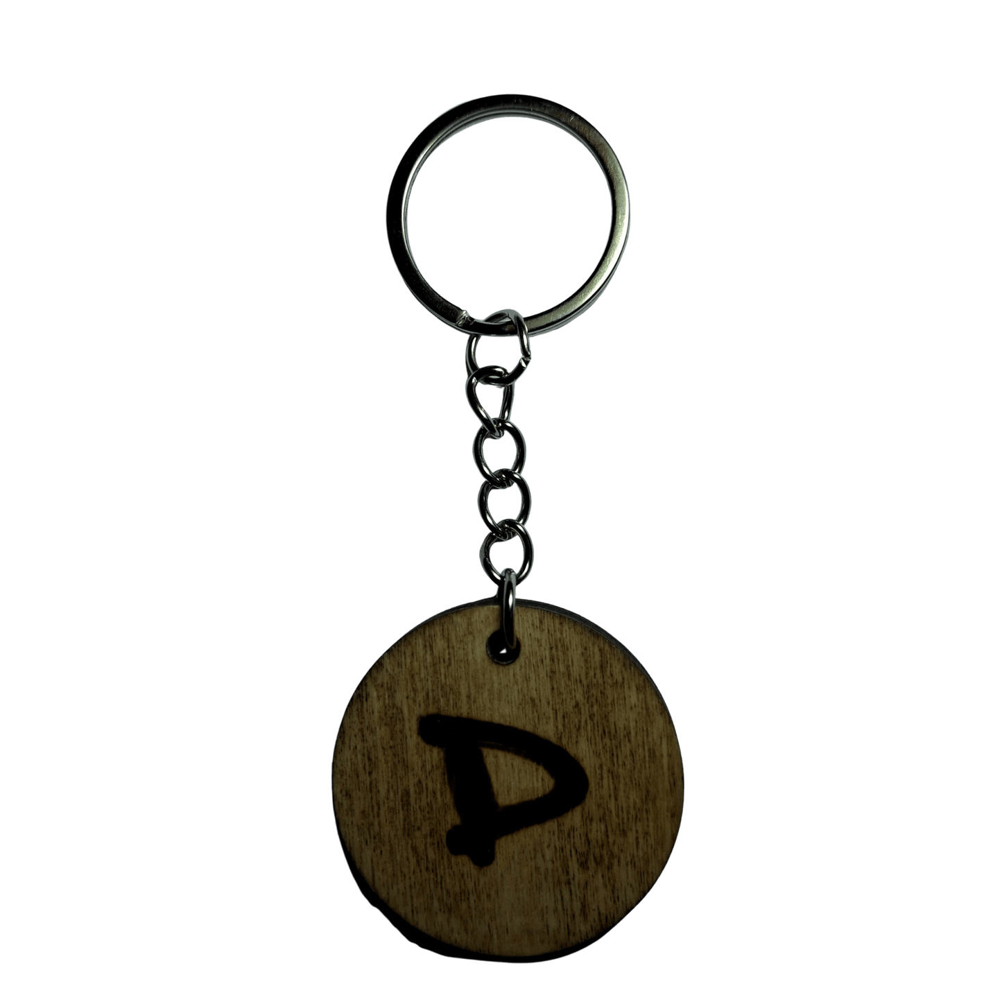 Round keyring made from veneered plywood. The letter D is hand-burnt using pyrography, finished with a hardwax oil, and attached to a silver keychain.