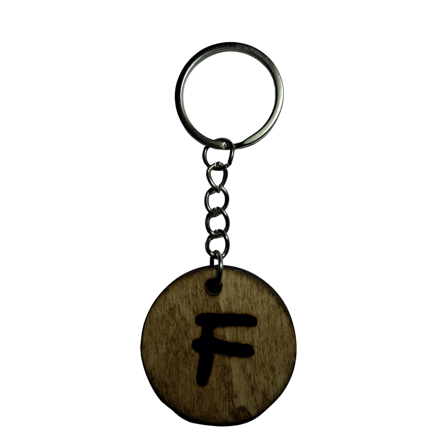 Round keyring made from veneered plywood. The letter F is hand-burnt using pyrography, finished with a hardwax oil, and attached to a silver keychain.