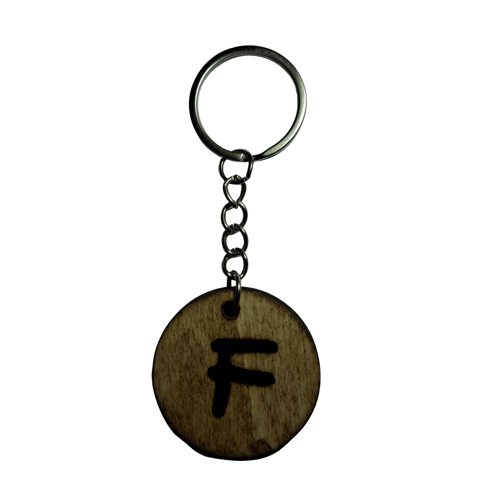 Round keyring made from veneered plywood. The letter F is hand-burnt using pyrography, finished with a hardwax oil, and attached to a silver keychain.