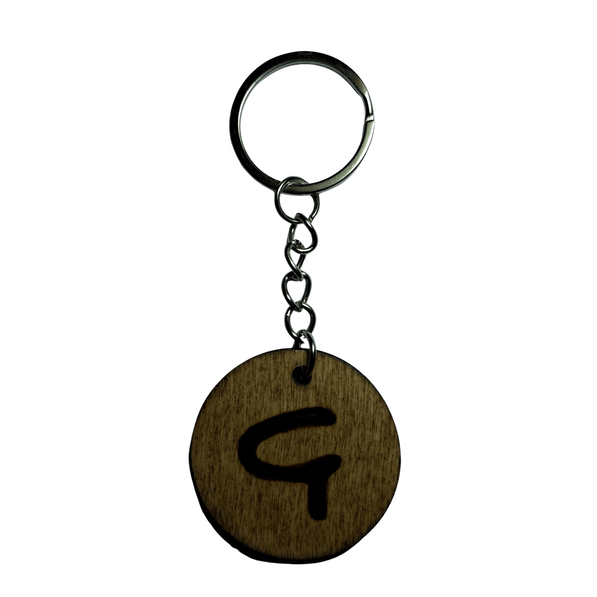 Round keyring made from veneered plywood. The letter G is hand-burnt using pyrography, finished with a hardwax oil, and attached to a silver keychain.