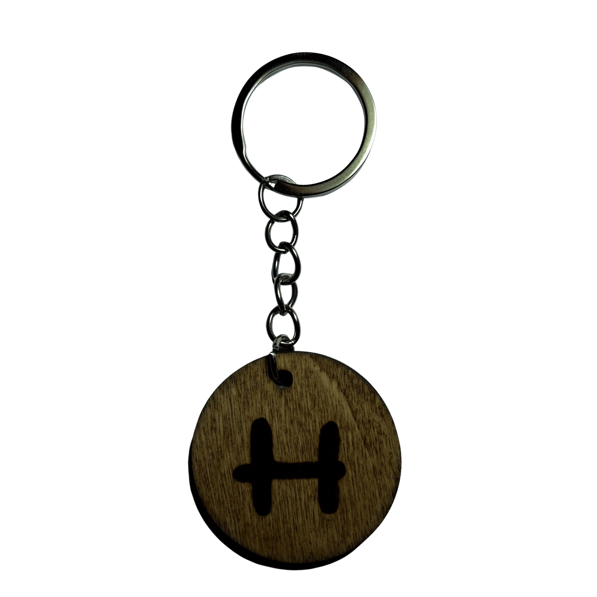 Round keyring made from veneered plywood. The letter H is hand-burnt using pyrography, finished with a hardwax oil, and attached to a silver keychain.