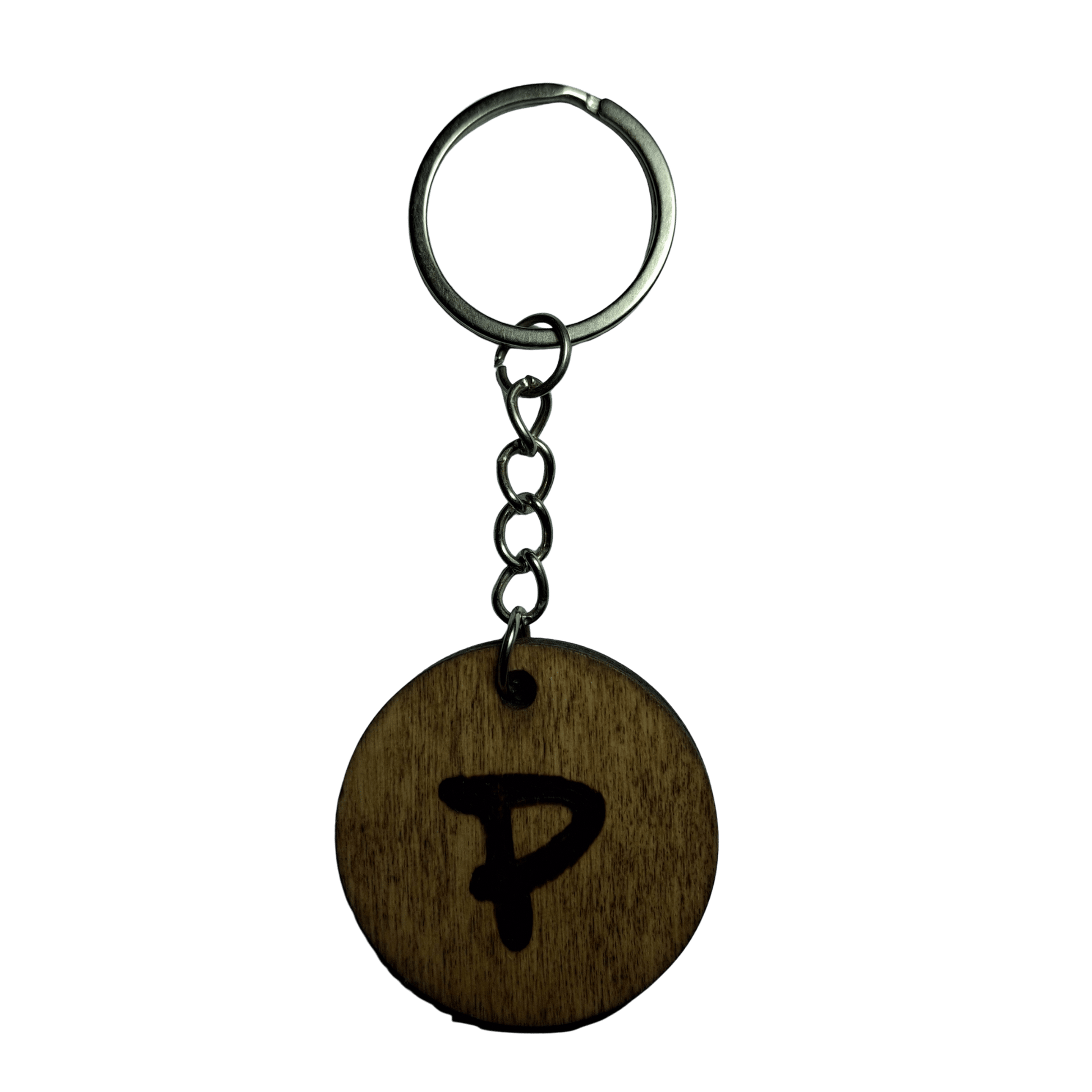 Round keyring made from veneered plywood. The letter P is hand-burnt using pyrography, finished with a hardwax oil, and attached to a silver keychain.
