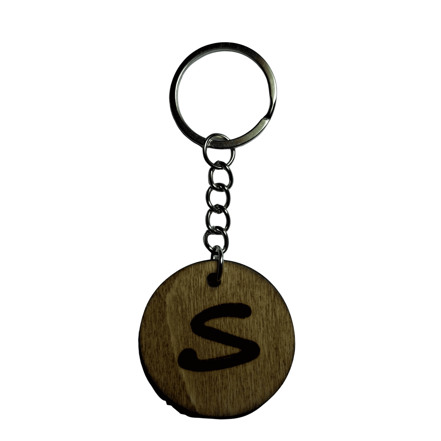 Round keyring made from veneered plywood. The letter S is hand-burnt using pyrography, finished with a hardwax oil, and attached to a silver keychain.