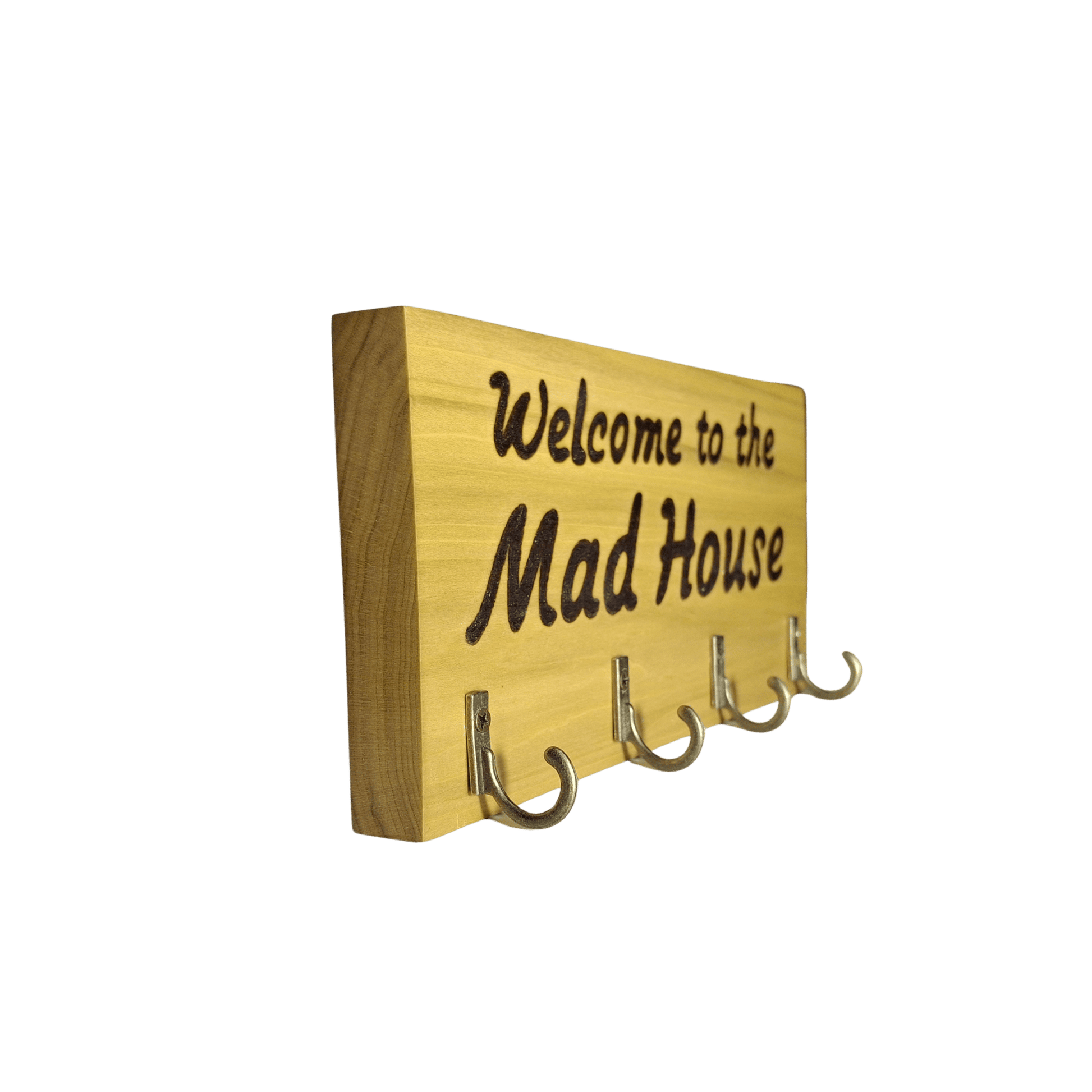 Wooden sign with 'Welcome to the Mad House' text and hooks on a green background