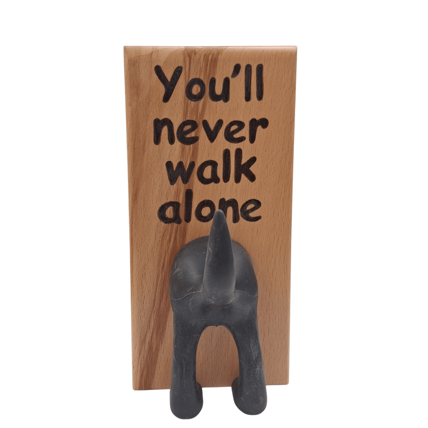 Wooden wall hook featuring the phrase "You'll never walk alone" created with pyrography (hand burnt lettering). A black dog's rear end forms the hook. 