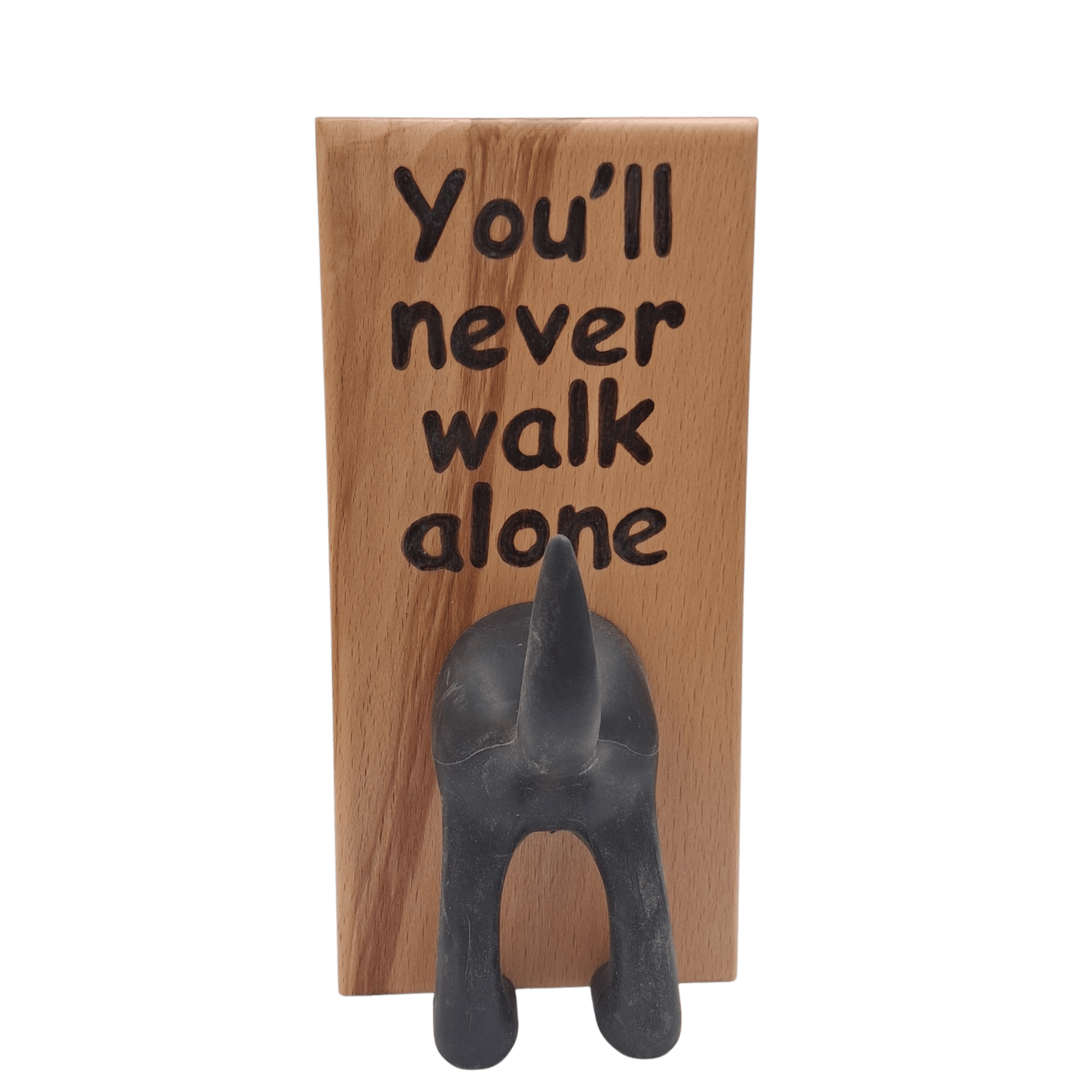 Wooden wall hook featuring the phrase "You'll never walk alone" created with pyrography (hand burnt lettering). A black dog's rear end forms the hook. 