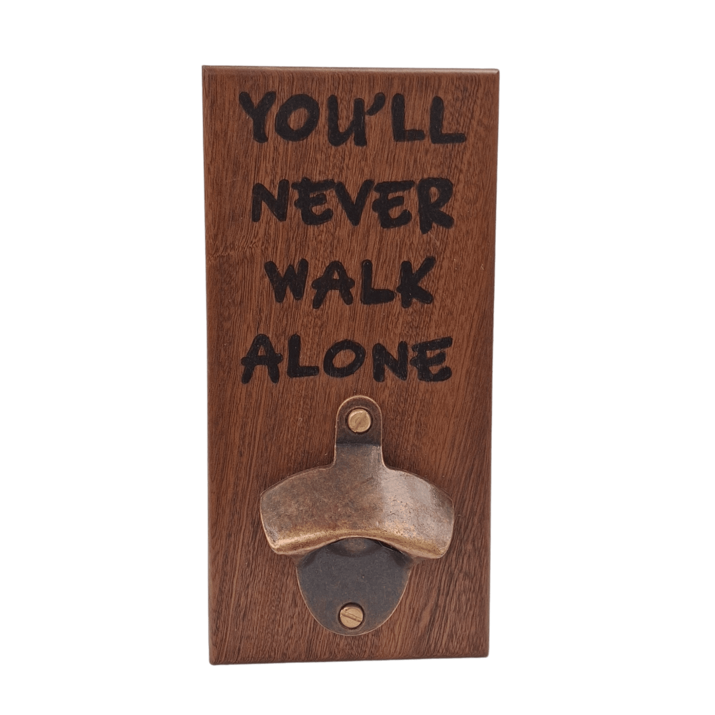 Wall-mounted bottle opener made from dark-grained wood (sapele). The text "YOU'LL NEVER WALK ALONE" is applied using pyrography (hand burnt lettering). A vintage-style metal opener is secured at the bottom of the plaque.