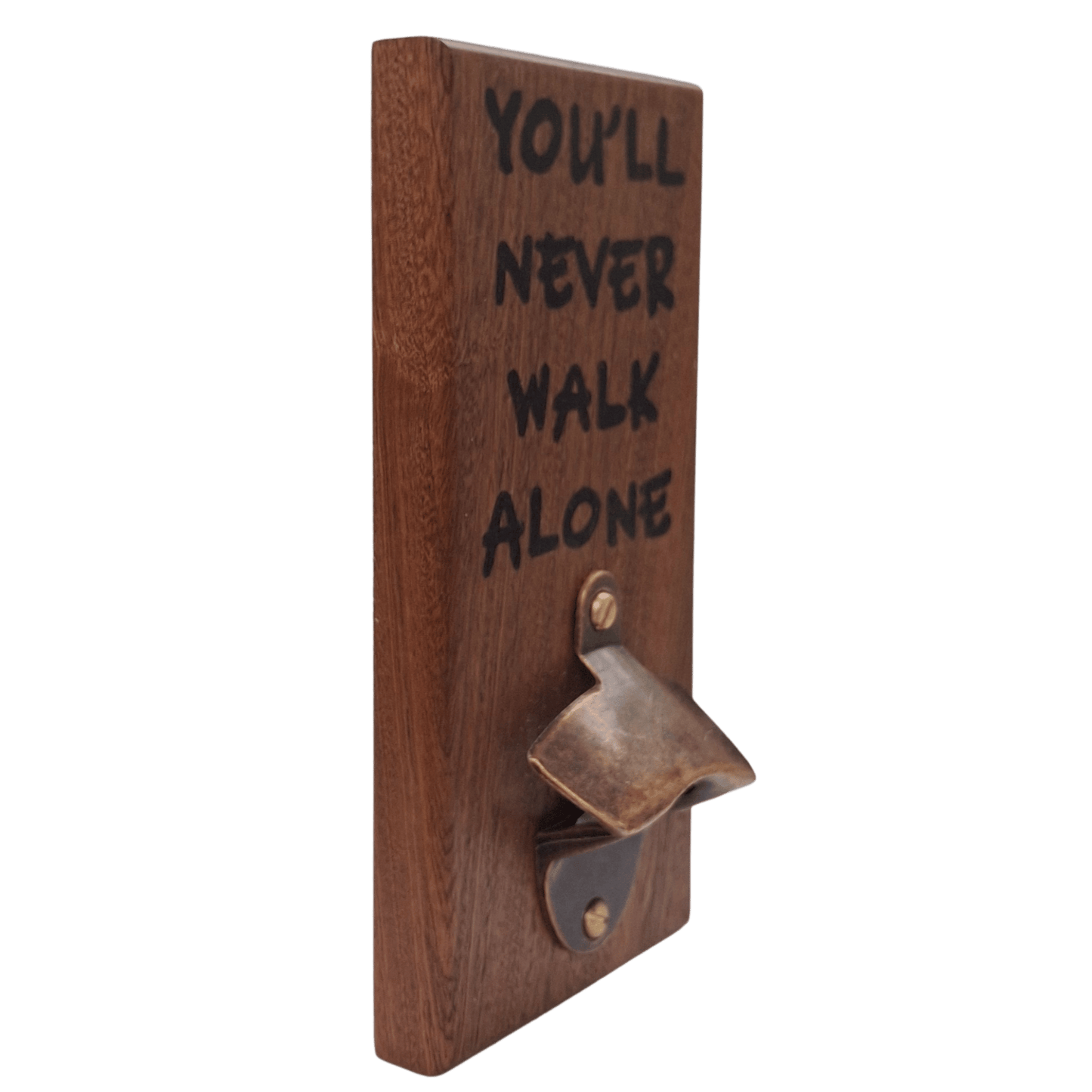 Wall-mounted bottle opener made from dark-grained wood (sapele). The text "YOU'LL NEVER WALK ALONE" is applied using pyrography (hand burnt lettering). A vintage-style metal opener is secured at the bottom of the plaque.